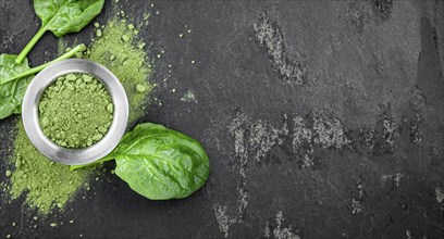 Freshly made green spinach powder (detailed close up shot, selective focus)