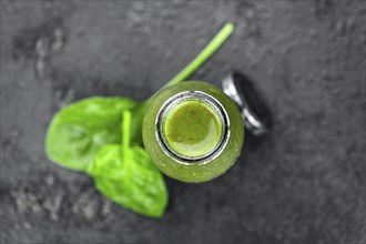 Homemade spinach smoothie (detailed close up shot, selective focus)