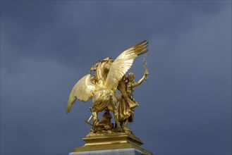 Column with the group of figures Fama of Agriculture on the Pont Alexandre III bridge over the