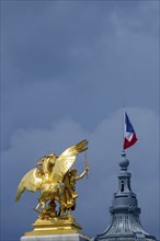 Column with the group of figures Fama of Agriculture on the Pont Alexandre III bridge over the