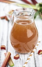 Portion of fresh made Rhubarb Juice (close up shot, selective focus)