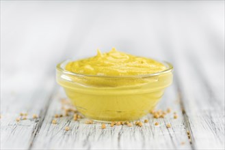 Mustard on a vintage background as detailed close-up shot (selective focus)