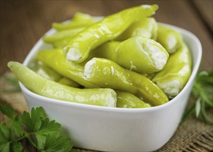 Some homemade Green Chilis (filled with cheese) (selective focus) as detailed close-up shot