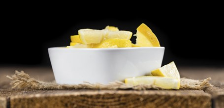 Lemon Slices on a vintage background as detailed close-up shot (selective focus)