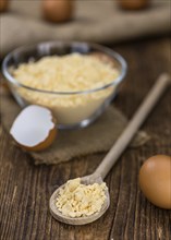 Vintage wooden table with Powdered Eggs (selective focus, close-up shot)