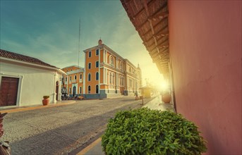 View of the street of the cathedral of Granada Nicaragua leading to La Calzada at sunset