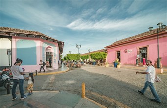 People walking along the street of La Calzada at sunset. Granada, Nicaragua. 05-10-2024