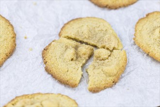 Vintage wooden table with Cookies (selective focus, close-up shot)