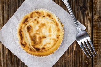 Homemade Cheesecake on vintage background (selective focus, close-up shot)