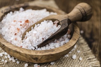 Pink Salt on a vintage background as detailed close-up shot (selective focus)