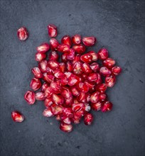 Portion of Pomegranate seeds (close-up shot, selective focus)