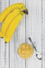 Mashed Bananas (selective focus, close-up shot) on a vintage background