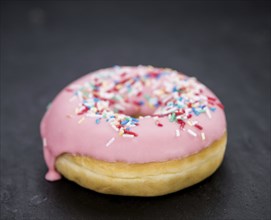 Portion of some Donuts as detailed close-up shot (fresh made, selective focus)