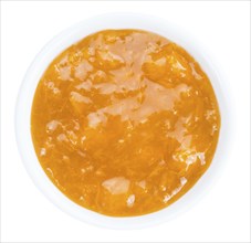 Apricot Jam isolated on white background (selective focus, close-up shot)