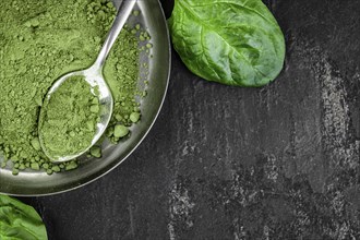 Homemade green spinach powder (close up shot, selective focus)