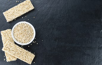 Some Quinoa Bars on a slate slab (close-up shot, selective focus)