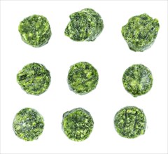 Portion of frozen spinach isolated on white background (close-up shot)