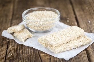 Fresh made Quinoa Bars (selective focus, close-up shot) on an old wooden table