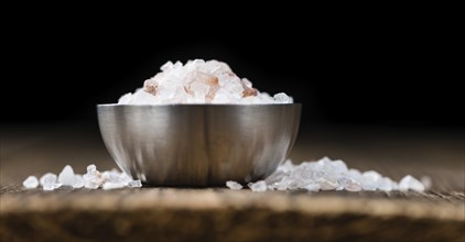 Pink Salt on a vintage background as detailed close-up shot (selective focus)