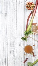 Rhubarb Juice on a rustic background (close up shot, selective focus)