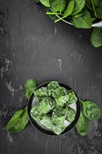 Portion of frozen spinach as detailed close up shot (selective focus)