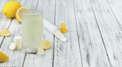 Vitamin C Tablets on a vintage background as detailed close-up shot, selective focus