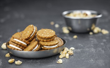 Portion of fresh made Hazelnut Cream Cookies as detailed close up shot (selective focus)