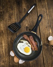 Portion of Bacon and Eggs (selective focus, close-up shot)