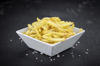 Portion of homemade French Fries (close-up shot, selective focus)