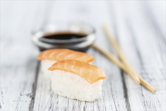 Some fresh made Sushi on a wooden table (selective focus, close-up shot)