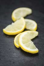 Some Lemon Slices on a vintage slate slab (selective focus)