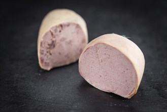 Liverwurst on a vintage background as detailed close-up shot (selective focus)