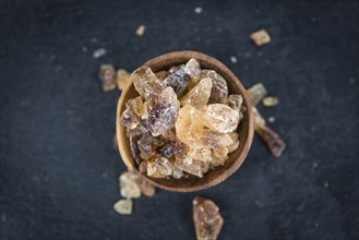 Portion of brown Rock Candy as detailed close-up shot (selective focus)