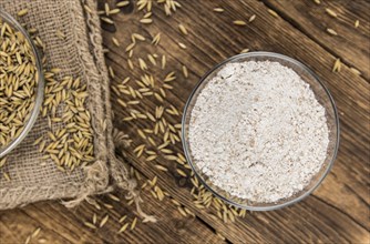 Portion of fresh Oat Flour on an old wooden table