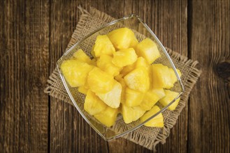 Fresh made Pineapple (sliced) on a vintage background as detailed close-up shot