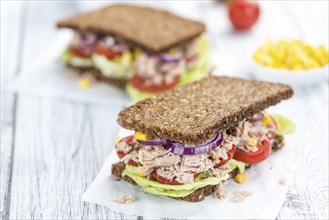 Tuna Sandwich (wholemeal bread, selective focus) on an old wooden table