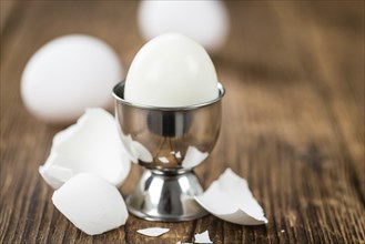 Wooden table with boiled Eggs (selective focus, close-up shot)