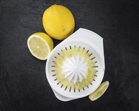 Lemon Juice on a vintage background as detailed close-up shot (selective focus)