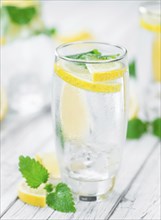 Homemade Lemonade on vintage background (selective focus, close-up shot)