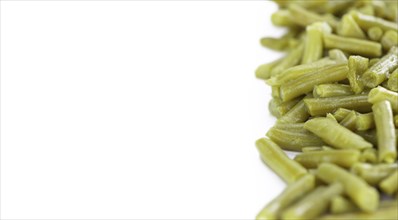 Portion of preserved Green Beans as detailed close-up shot isolated on white background (selective