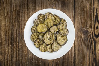 Homemade Antipasti (Grilled Zucchinis) on vintage background (selective focus, close-up shot)