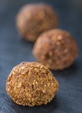 Wooden table with Falafels (close-up shot, selective focus)