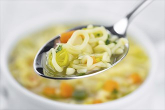 Portion of fresh made Alphabet Soup (selective focus, close-up shot)