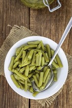 Portion of preserved Green Beans as detailed close-up shot (selective focus)