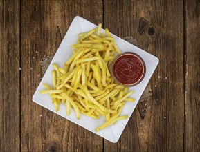 Portion of fresh made French Fries (close-up shot, selective focus)