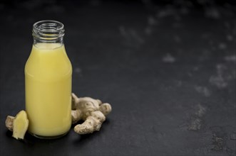 Portion of healthy Ginger Drink (selective focus, close-up shot)