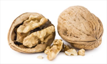 Portion of Walnuts (as close-up shot) isolated on white background