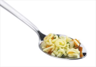 Homemade Alphabet Soup (selective focus) isolated on white background