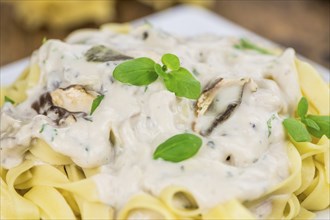 Porcini pasta on a vintage background as detailed close-up shot, selective focus