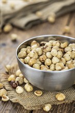 Peeled Hazelnuts as detailed close up shot (selective focus)